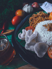 High angle view of fruits in plate on table