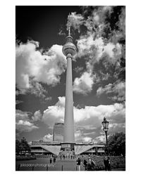 Low angle view of tower against cloudy sky