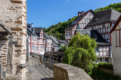 River elz with old bridge and half-timbered houses in monreal, germany