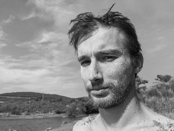 Portrait of shirtless young man in water