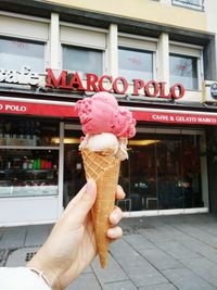 Close-up of hand holding ice cream