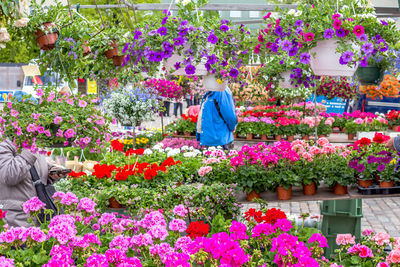 Rear view of woman with multi colored flowers