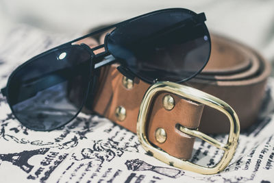Close-up of sunglasses with belt