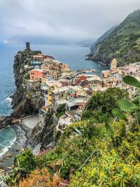 High angle view of townscape by sea