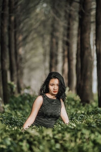 Portrait of a young woman in forest
