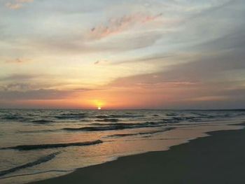 Scenic view of calm sea at sunset