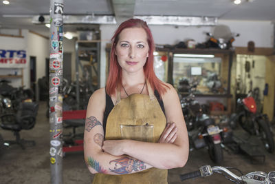 A portrait of a young woman in a dirty apron.