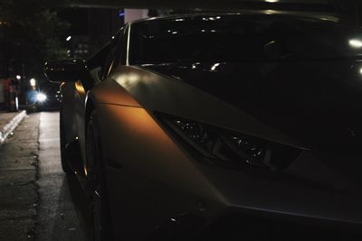 Close-up of car in city at night