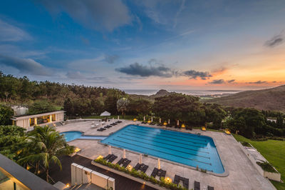 High angle view of swimming pool by sea against sky