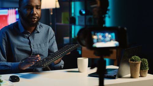 Portrait of man using laptop on table