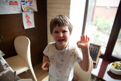 Young boy cries at the table