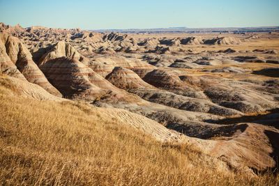 Scenic view of arid landscape against sky