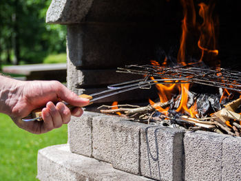 Close-up of hand holding bonfire