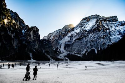 People on snow covered landscape