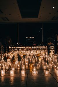 Illuminated tea lights on floor