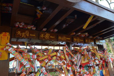 Low angle view of illuminated lanterns hanging outside building