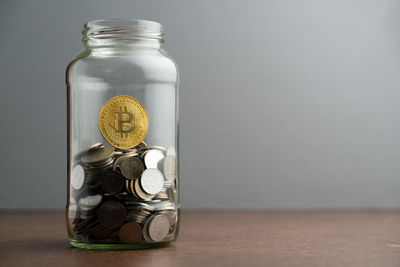 Close-up of candle in jar on table