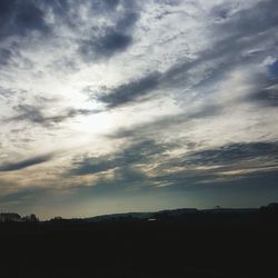 Silhouette trees against sky during sunset