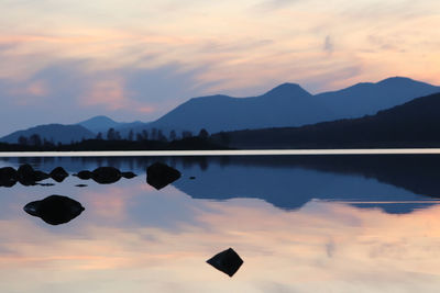 The mountains of glencoe reflected in the calm evening water of loch laidon, rannoch scotland