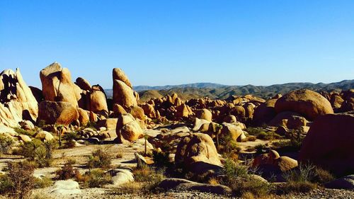 Panoramic view of rocks against clear sky