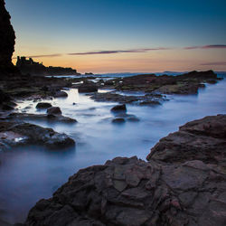 Scenic view of sea at sunset