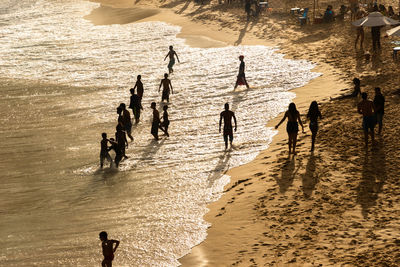 Large group of people on paciencia beach in the rio vermelho neighborhood of salvador, brazil. 