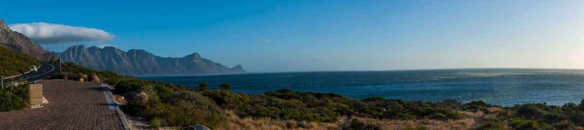 Panoramic view of sea against blue sky