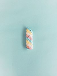 Close-up of multi colored pencils over white background