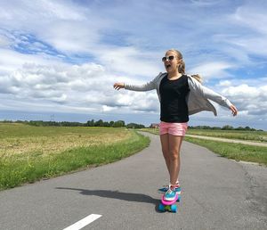 Portrait of a young girl on a skateboard