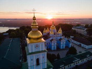 High angle view of buildings against sky during sunset