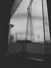 Low angle view of power lines against sky