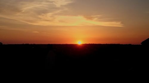 Scenic view of silhouette landscape against sky during sunset