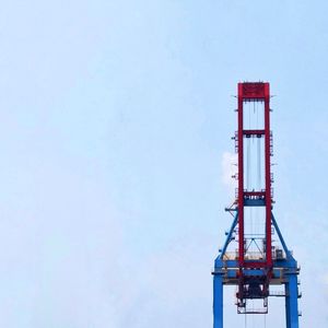 Low angle view of red tower against clear sky