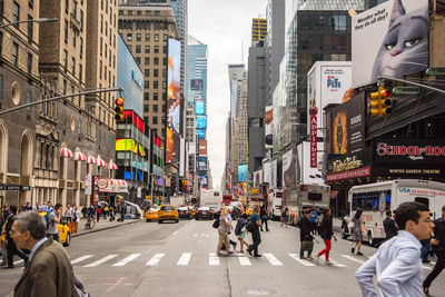 People walking on road in city