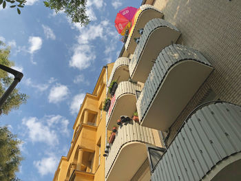 Low angle view of buildings against sky in city