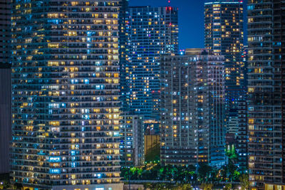 Buildings in city at night