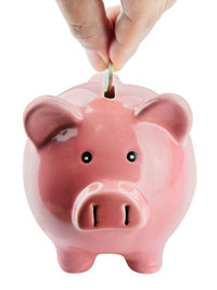 Midsection of person holding hands against gray background