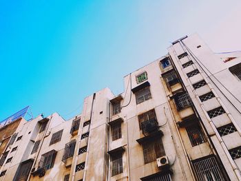 Low angle view of building against blue sky