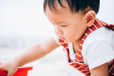 Cute boy looking at water