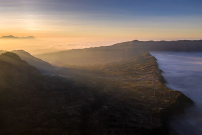 Scenic view of mountains against sky during sunset