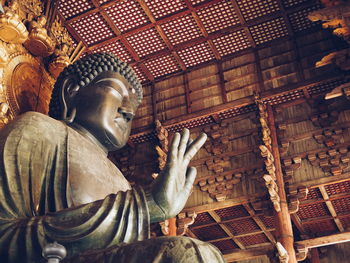 Low angle view of buddha statue