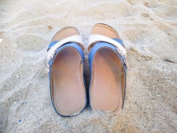 High angle view of shoes on sand