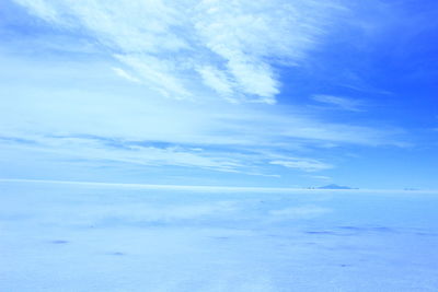 Scenic view of sea against blue sky