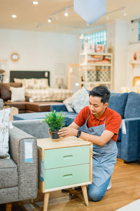 Side view of man working at home