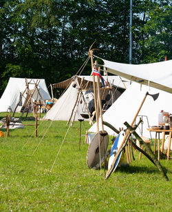 Tent on field against trees