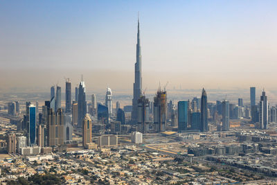 Modern buildings in city against sky