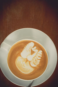 Close-up of cappuccino on table