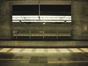 Illuminated railroad station at night