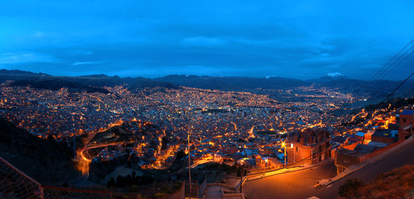 High angle view of illuminated buildings in city at night