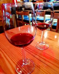 Close-up of wine glasses on table